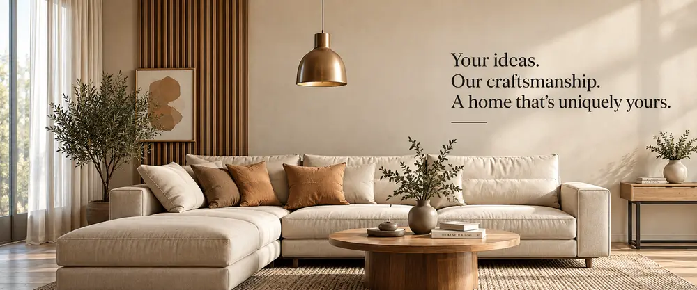 A made-to-order living room by New Galaxy Furniture — a large beige sectional, round walnut coffee table and brass pendant, beside the words "Your ideas. Our craftsmanship. A home that’s uniquely yours."